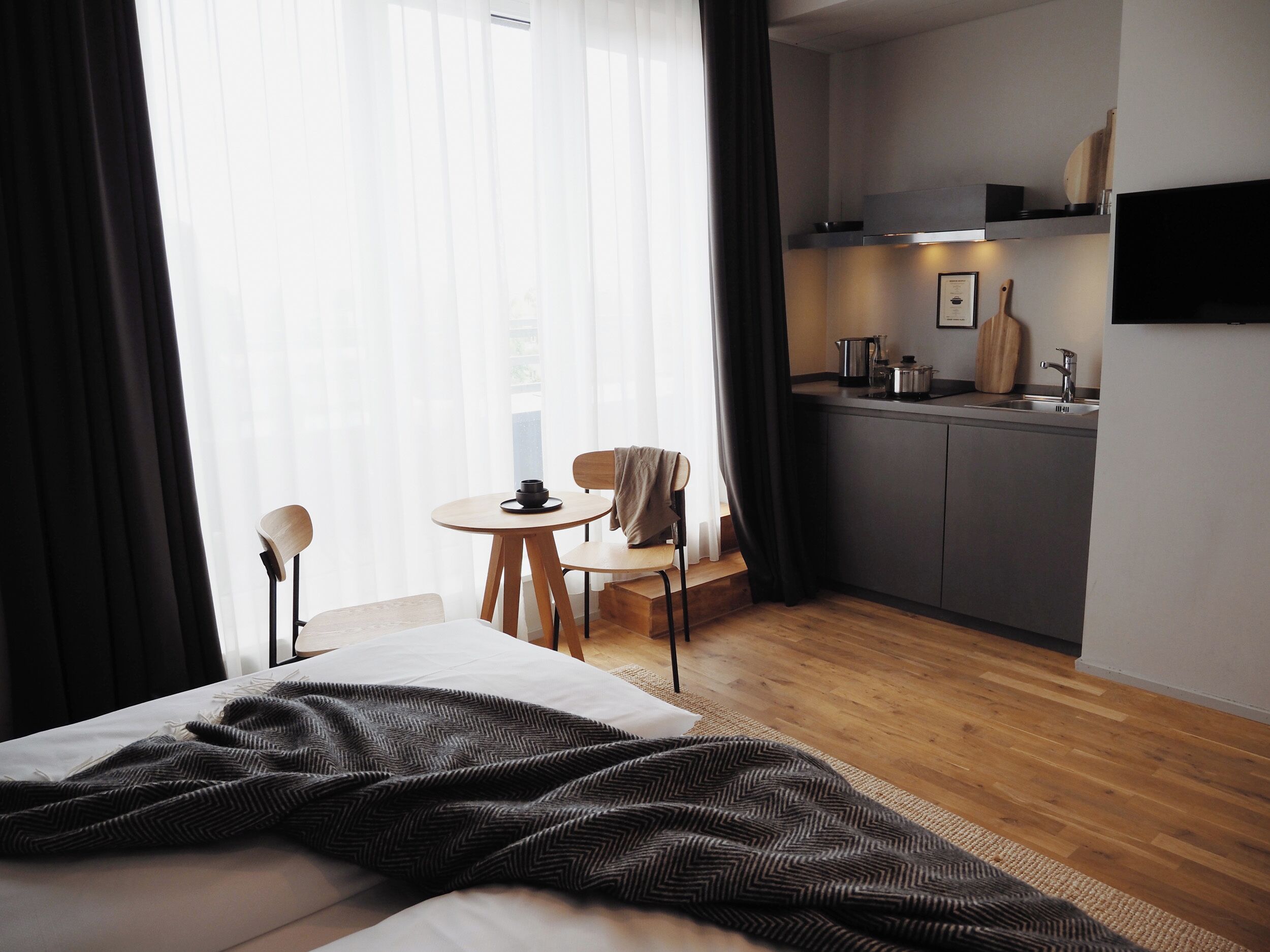 bold studio with balcony | hypo-allergenic bedding, desk, laptop workspace, blackout curtains