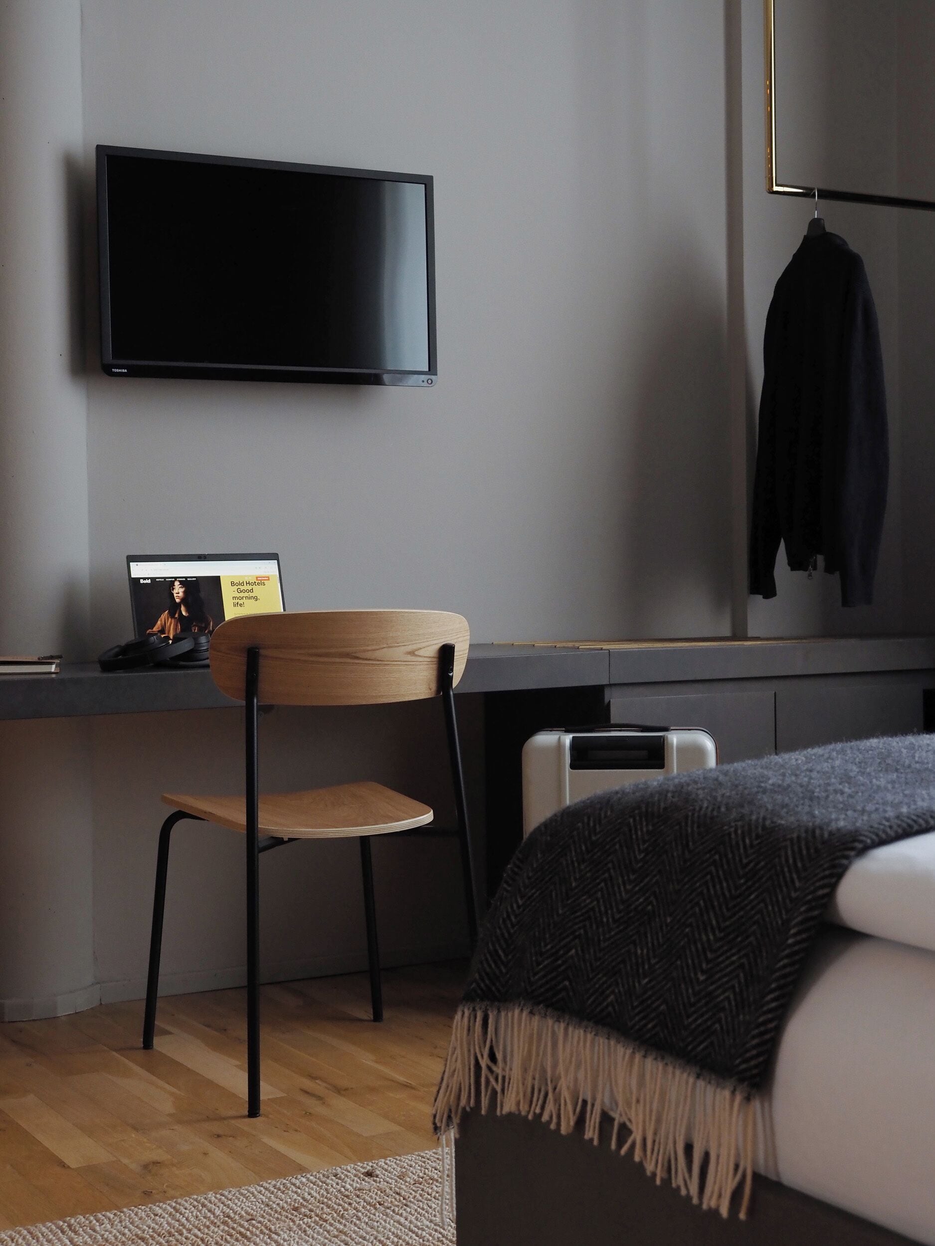 hypo-allergenic bedding, desk, laptop workspace, blackout curtains