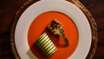 A plate of food on a wooden table.