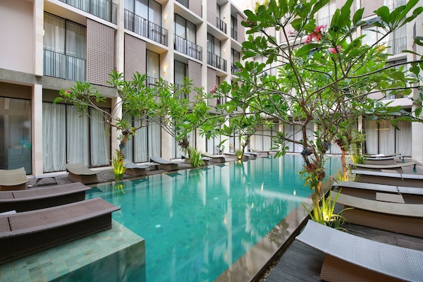 Outdoor pool, open 7:00 AM to 7:00 PM, pool loungers