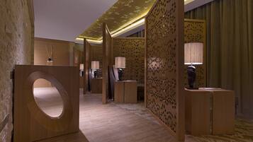 A modern hotel lobby with a wooden reception desk, decorative panels, and ambient lighting.