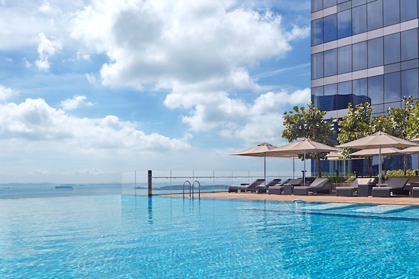 Outdoor pool, open 6:00 AM to 10:00 PM, pool umbrellas, sun loungers