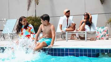 Outdoor pool, open 9:00 AM to 10:00 PM, pool loungers