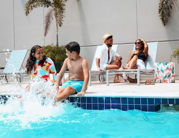 Outdoor pool, open 9:00 AM to 10:00 PM, sun loungers at Hyatt Place Bayamon