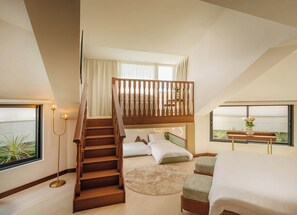 A bedroom with a wooden staircase, a bed, a desk, and a window with a view.