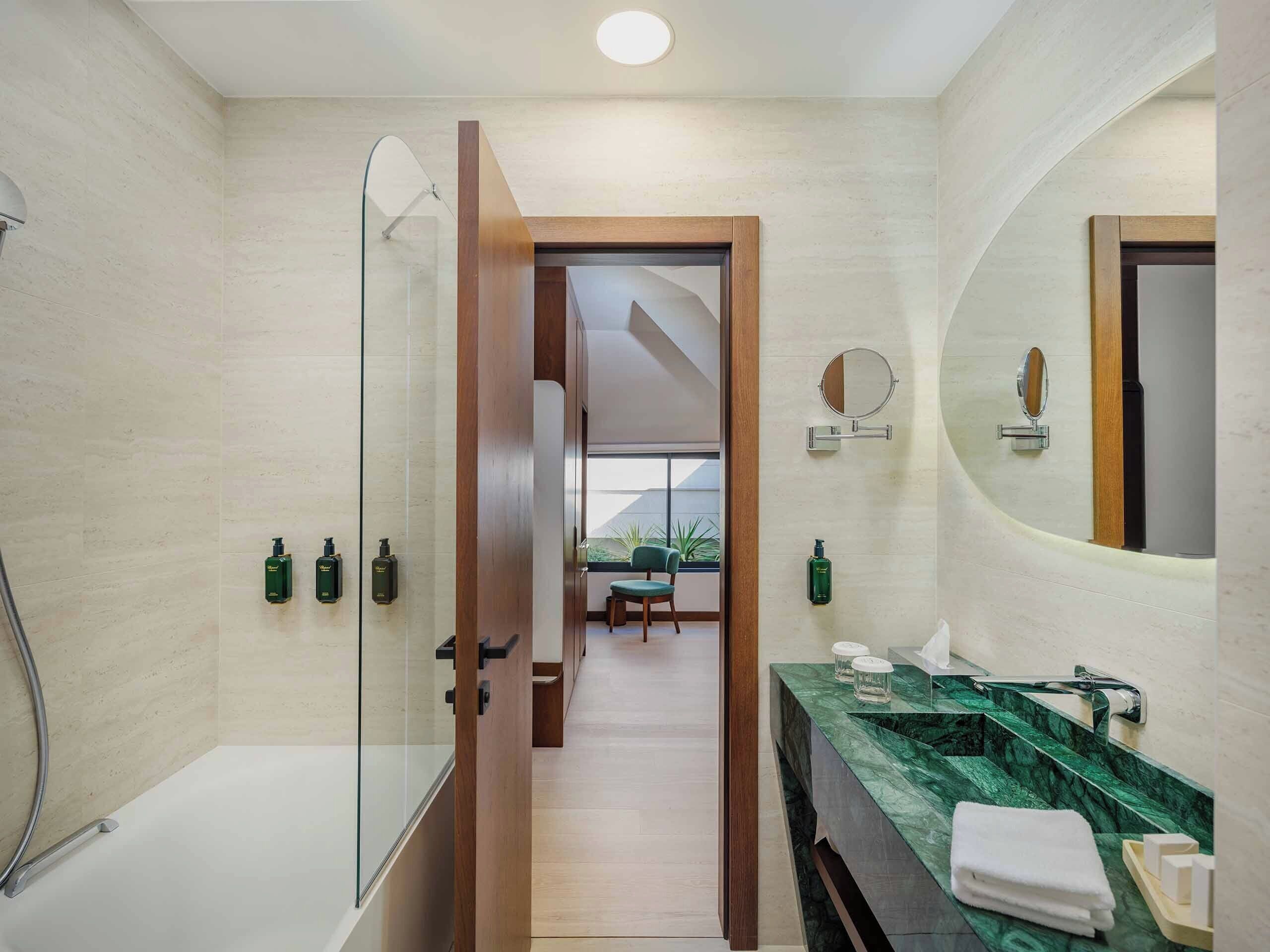 family suite | bathroom | designer toiletries, hair dryer, bathrobes, slippers