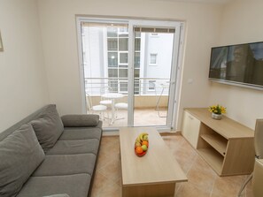 公寓, 1 间卧室, 阳台 (2 Adults + 2 Children) | 起居区 | 平板电视