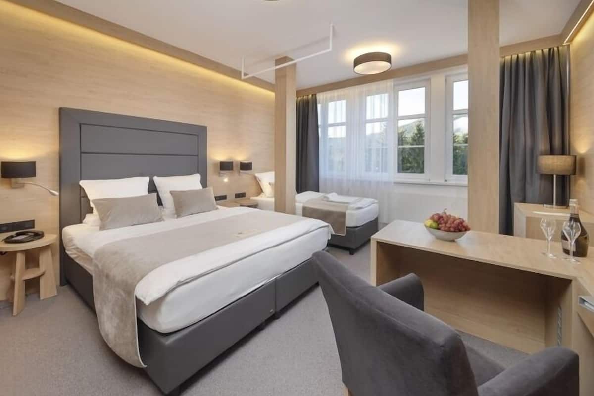 superior triple room, hill view | minibar, in-room safe, desk, iron/ironing board