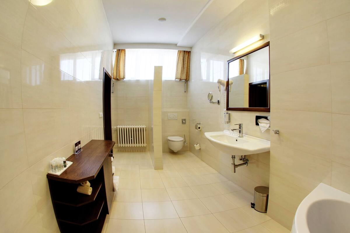 junior suite, sauna | minibar, in-room safe, desk, blackout curtains