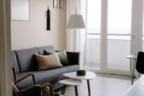 Apartment, 1 Bedroom, Balcony, Sea View | Living room | TV, books - Hotel Sandvig Havn (Allinge)