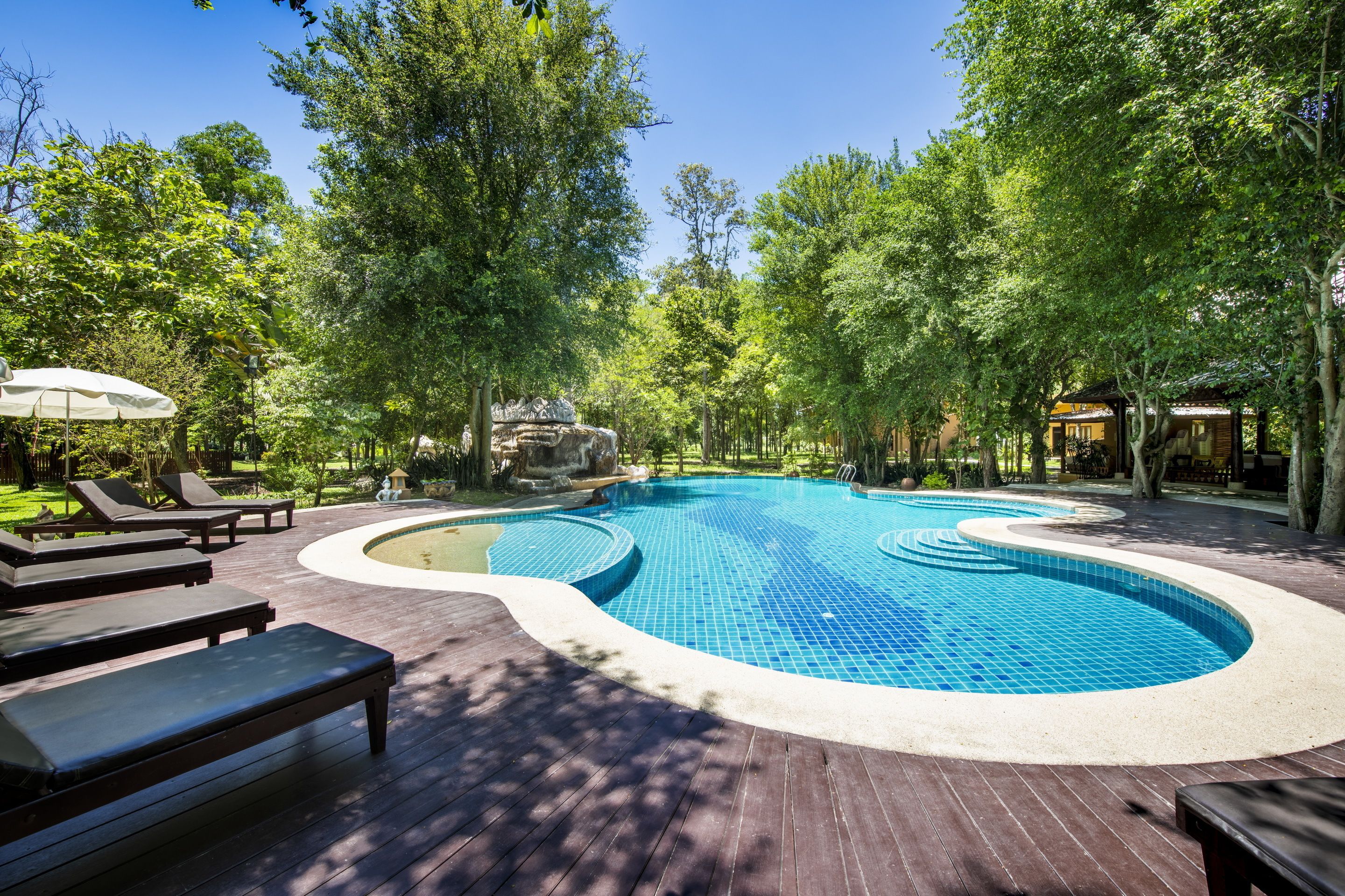 outdoor pool, pool umbrellas, pool loungers