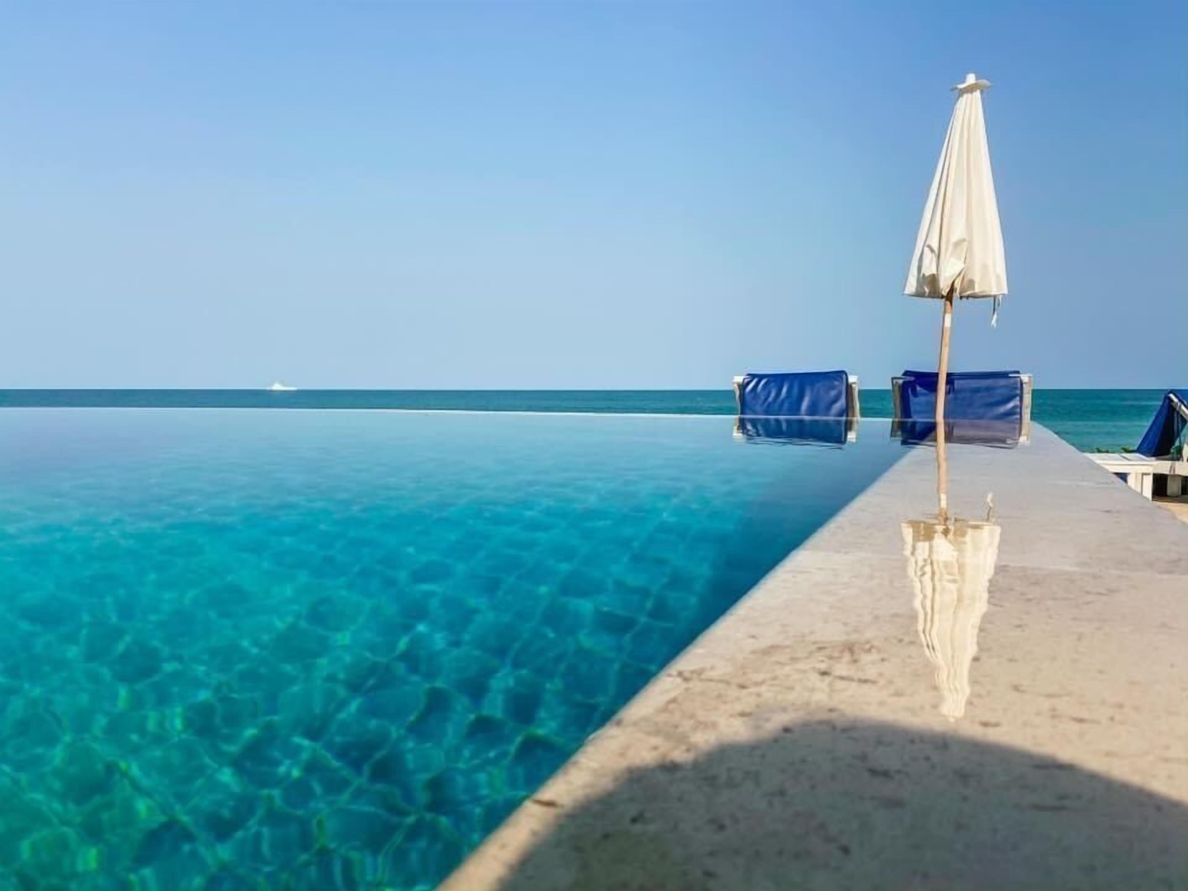 outdoor pool, pool umbrellas, pool loungers