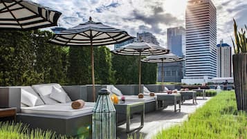 Outdoor pool, open 6:00 AM to 10:00 PM, pool umbrellas, pool loungers