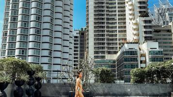Outdoor pool, open 6:00 AM to 10:00 PM, pool umbrellas, pool loungers