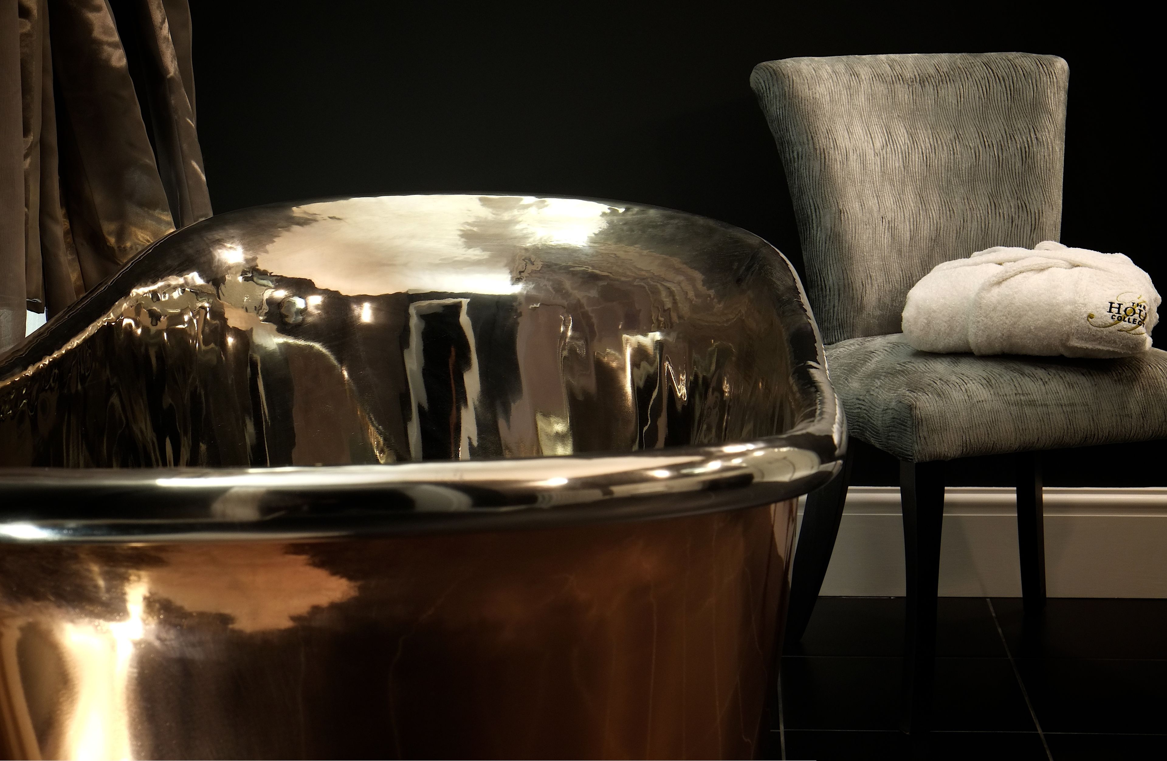 separate bathtub and shower, rainfall showerhead, designer toiletries