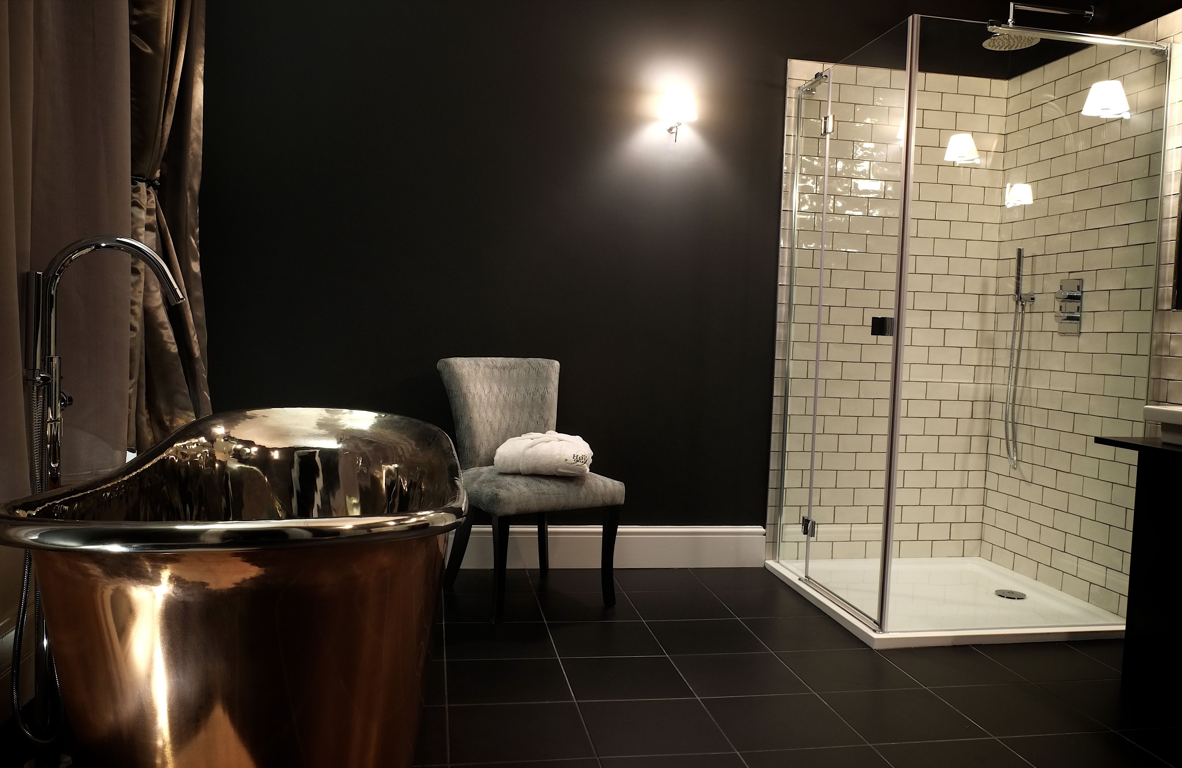 separate bathtub and shower, rainfall showerhead, designer toiletries