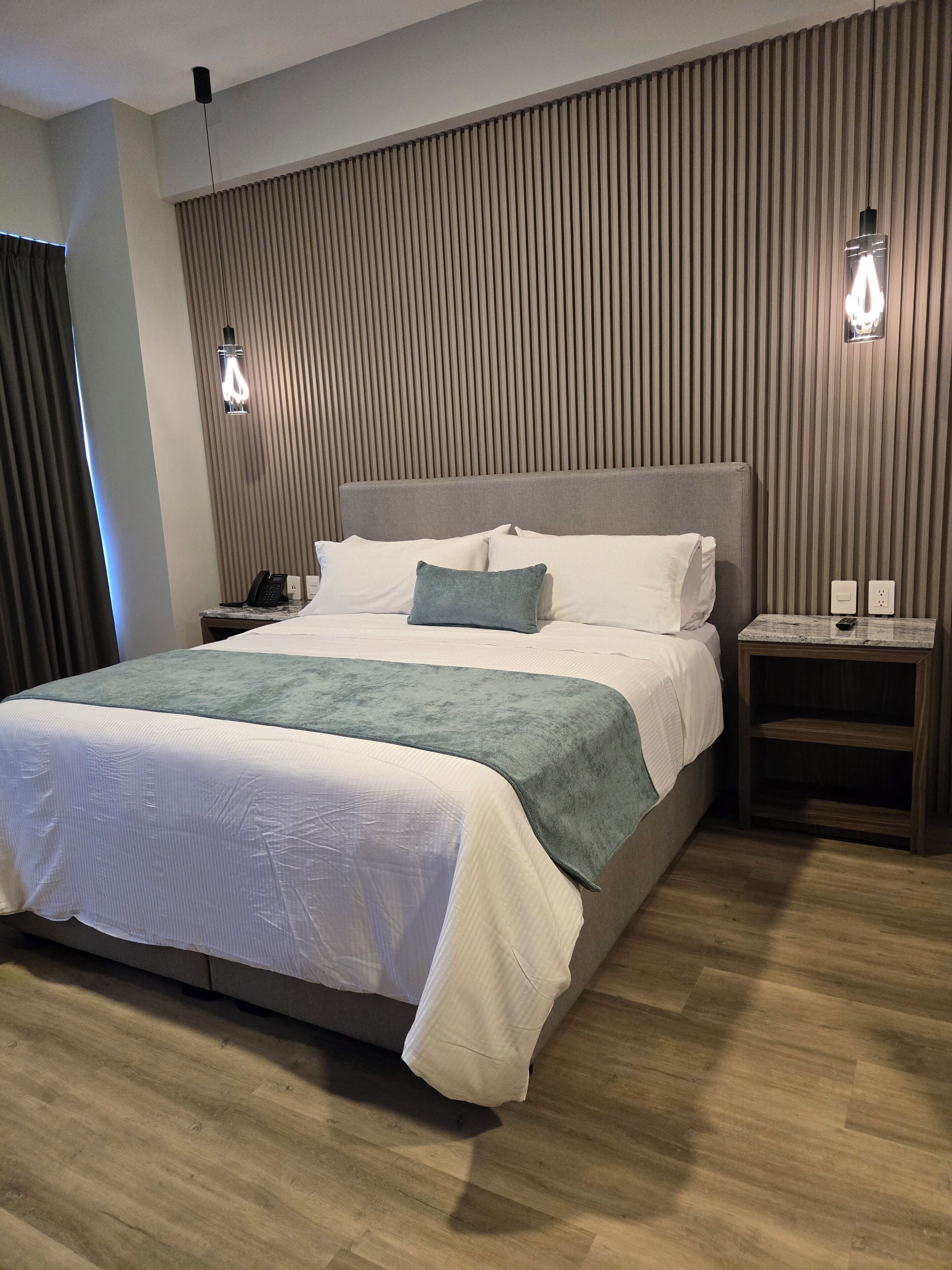 Deluxe Room, 1 King Bed | In-room safe, desk, laptop workspace, iron/ironing board