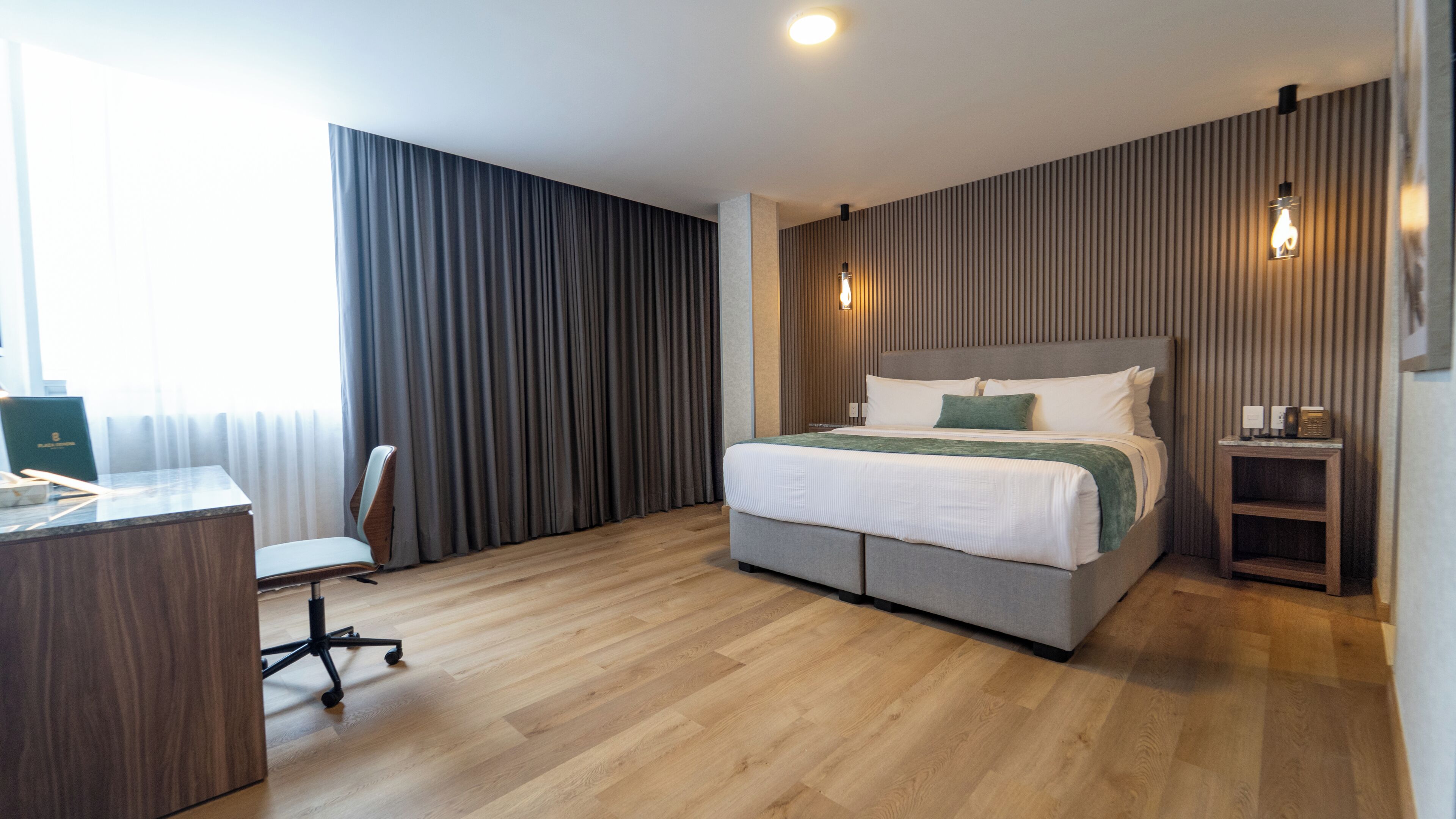 Deluxe Room, 1 King Bed | In-room safe, desk, laptop workspace, iron/ironing board
