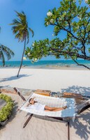 On the beach, white sand, sun loungers