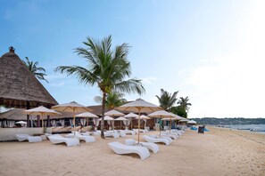 On the beach, sun loungers, beach umbrellas, snorkeling