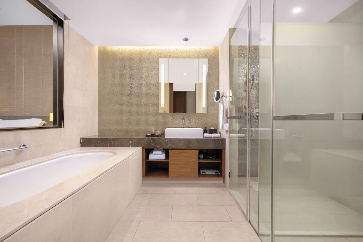 separate bathtub and shower, rainfall showerhead, designer toiletries