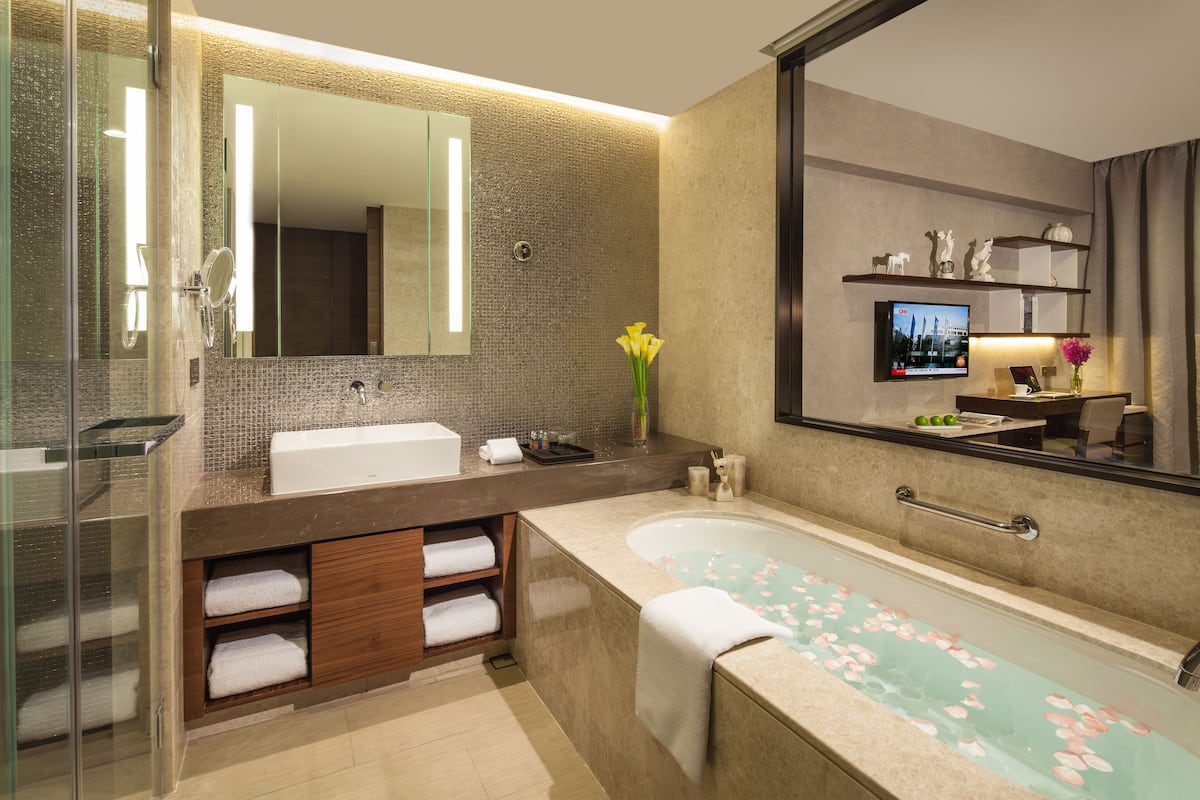 Separate bathtub and shower, rainfall showerhead, designer toiletries