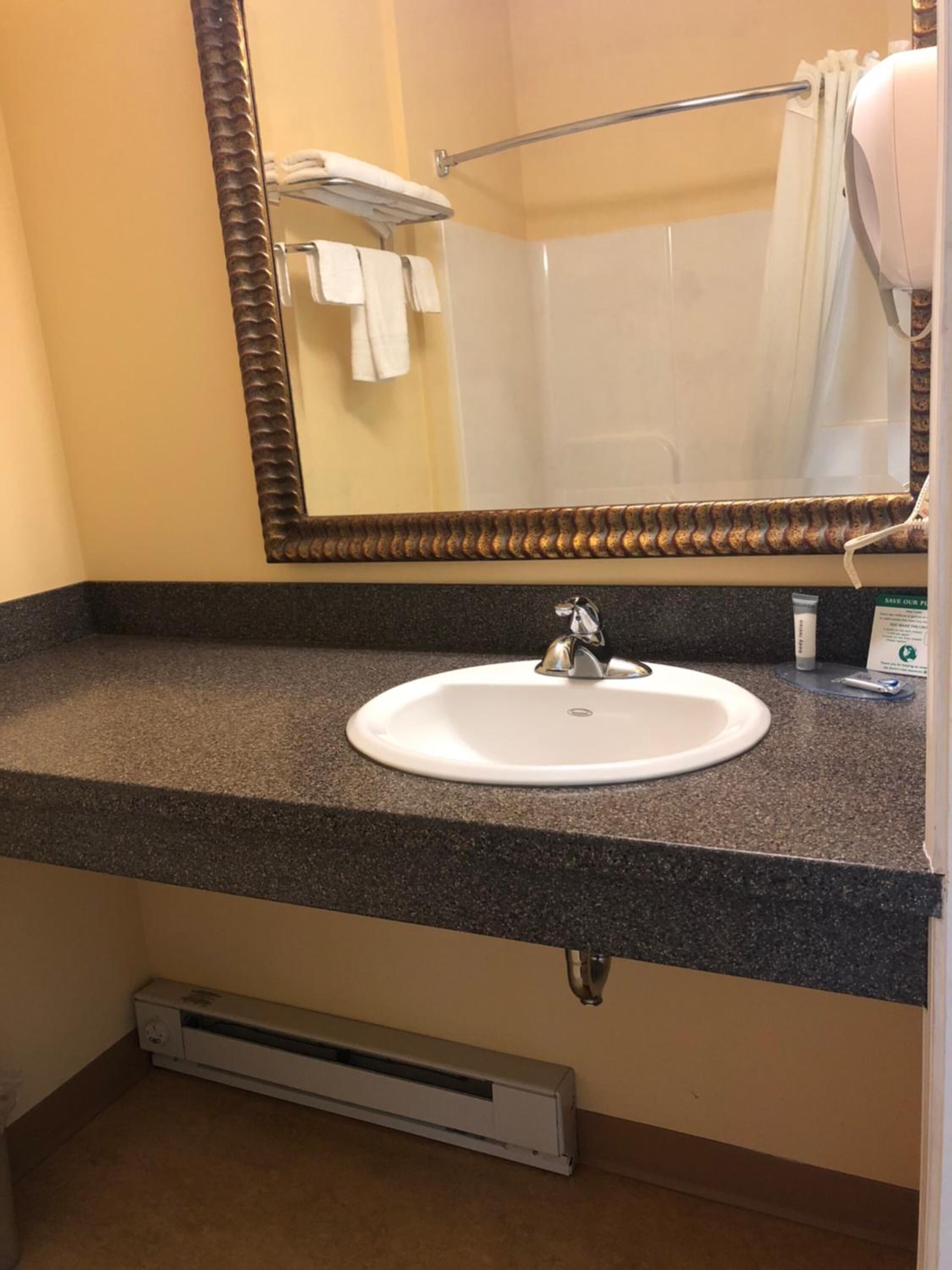 Bathtub, hair dryer, towels