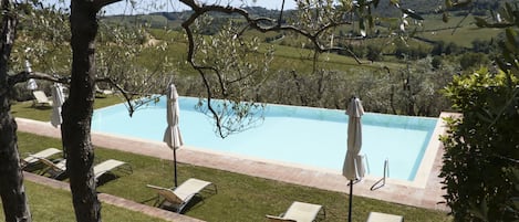 Seasonal outdoor pool, an infinity pool, pool umbrellas, sun loungers