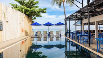 Outdoor pool, open 7:00 AM to 6:00 PM, pool umbrellas, pool loungers