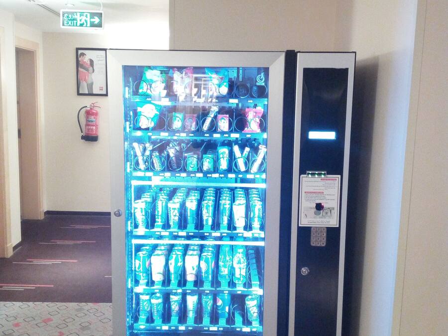 A vending machine with various beverages and snacks.