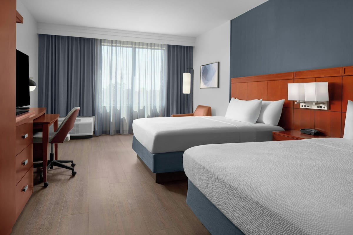 Room, 2 Queen Beds | In-room safe, desk, laptop workspace, blackout drapes