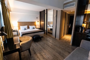 Suite, 1 King Bed, City View | Down comforters, pillowtop beds, minibar, in-room safe