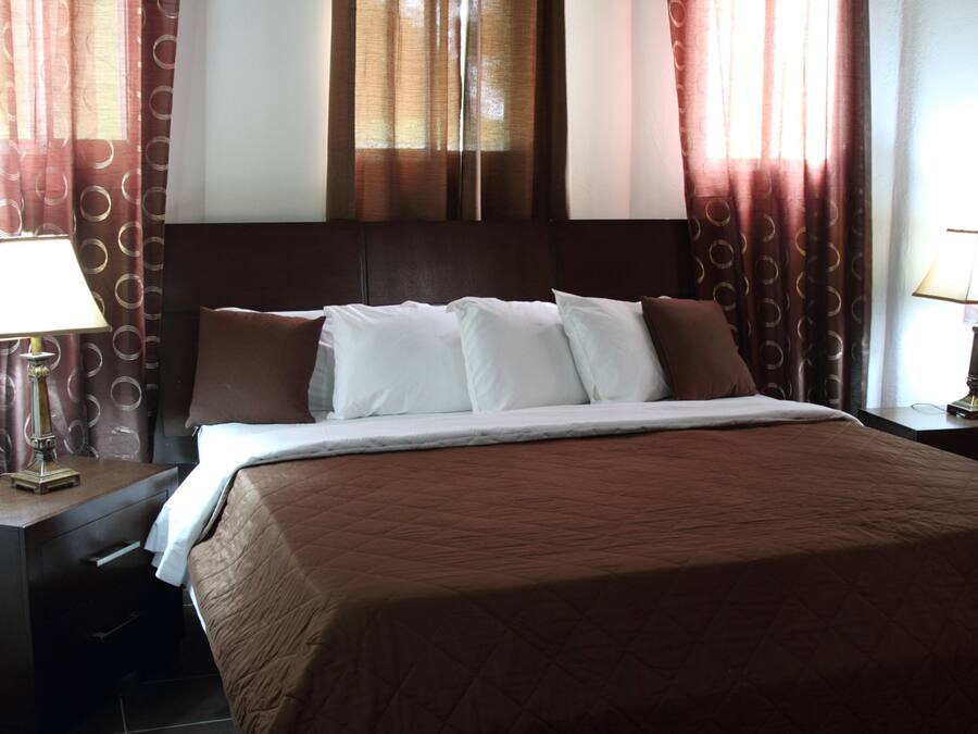 Deluxe Suite | Down comforters, Select Comfort beds, individually decorated