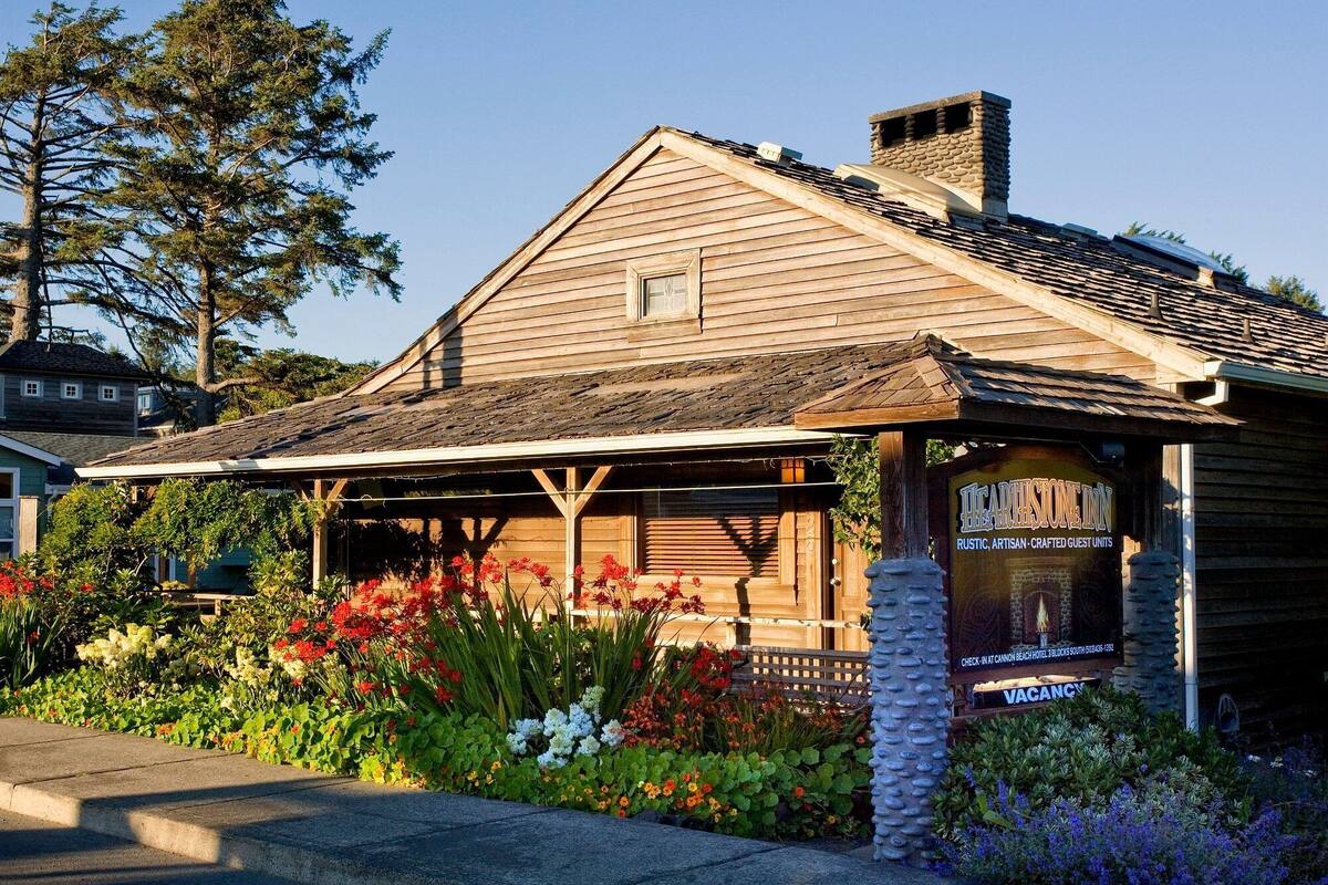 A rustic wooden building with a sloped roof, a small window, and a sign indicating a vacant status.