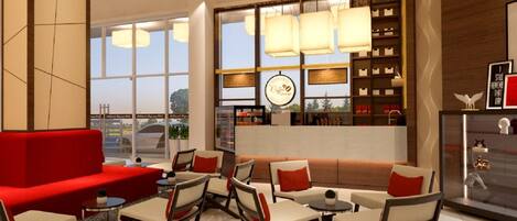 A modern lounge area with a red sofa, multiple chairs, and tables. There are large windows providing natural light and a view of the outside.