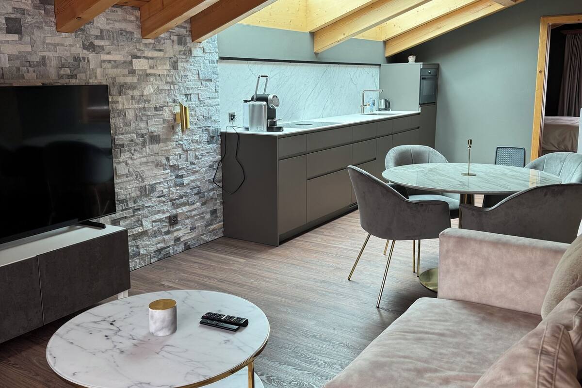 Luxury Suite, Balcony | Living area | Flat-screen TV