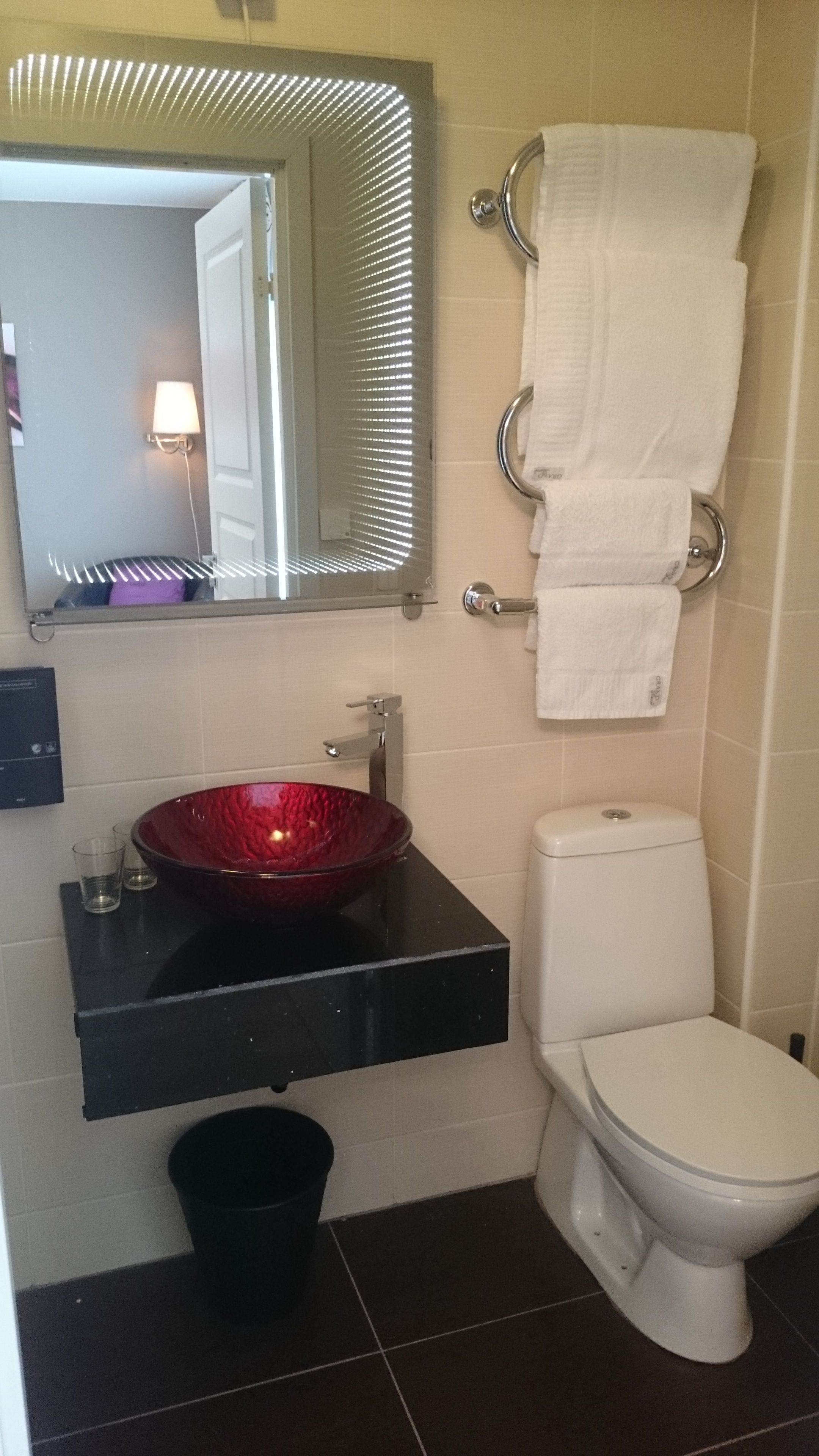 shower, hair dryer, towels, shampoo