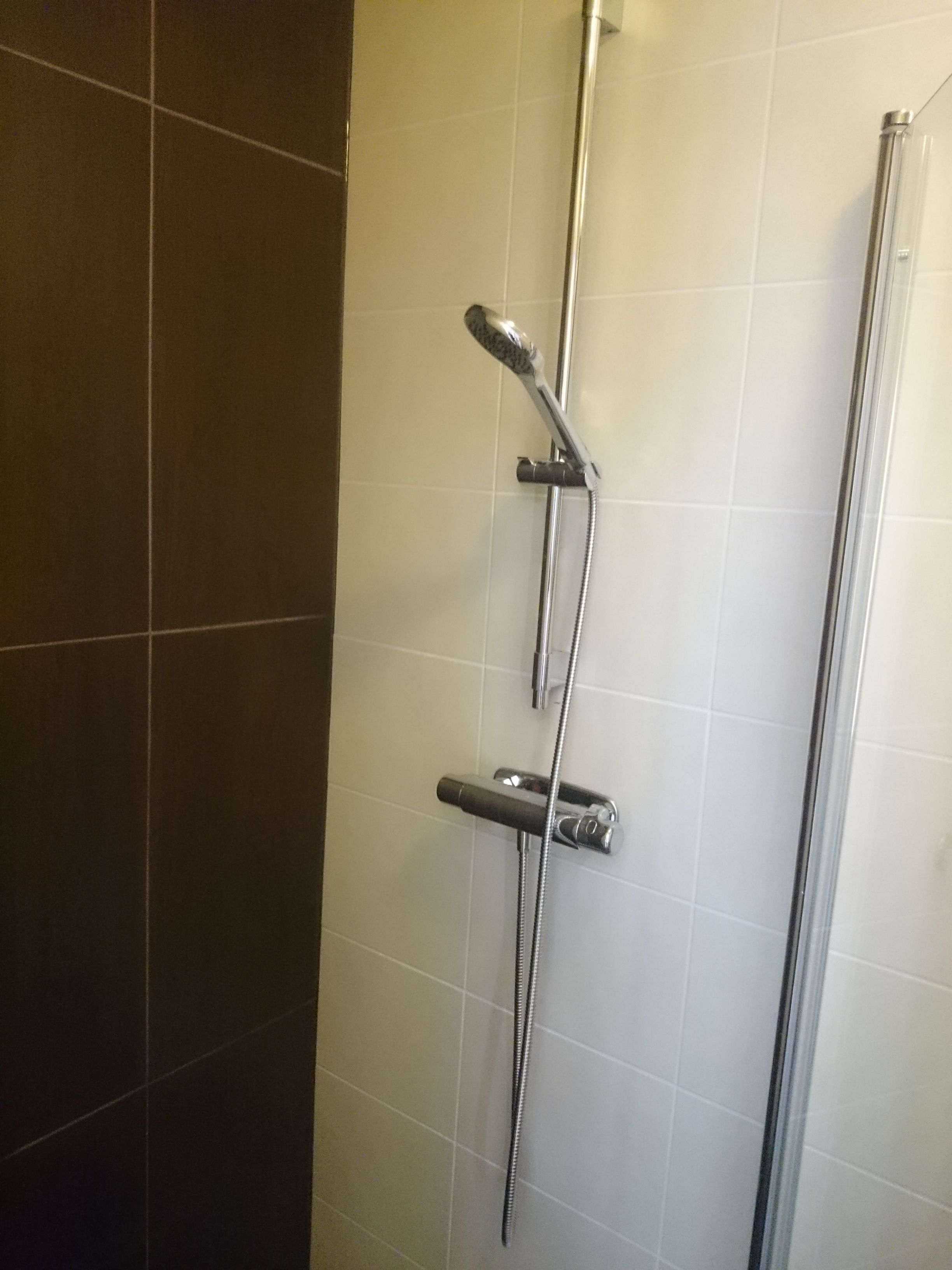 shower, hair dryer, towels, shampoo