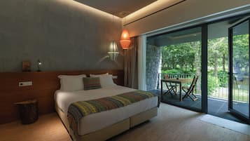 Premium bedding, laptop workspace, blackout drapes, soundproofing