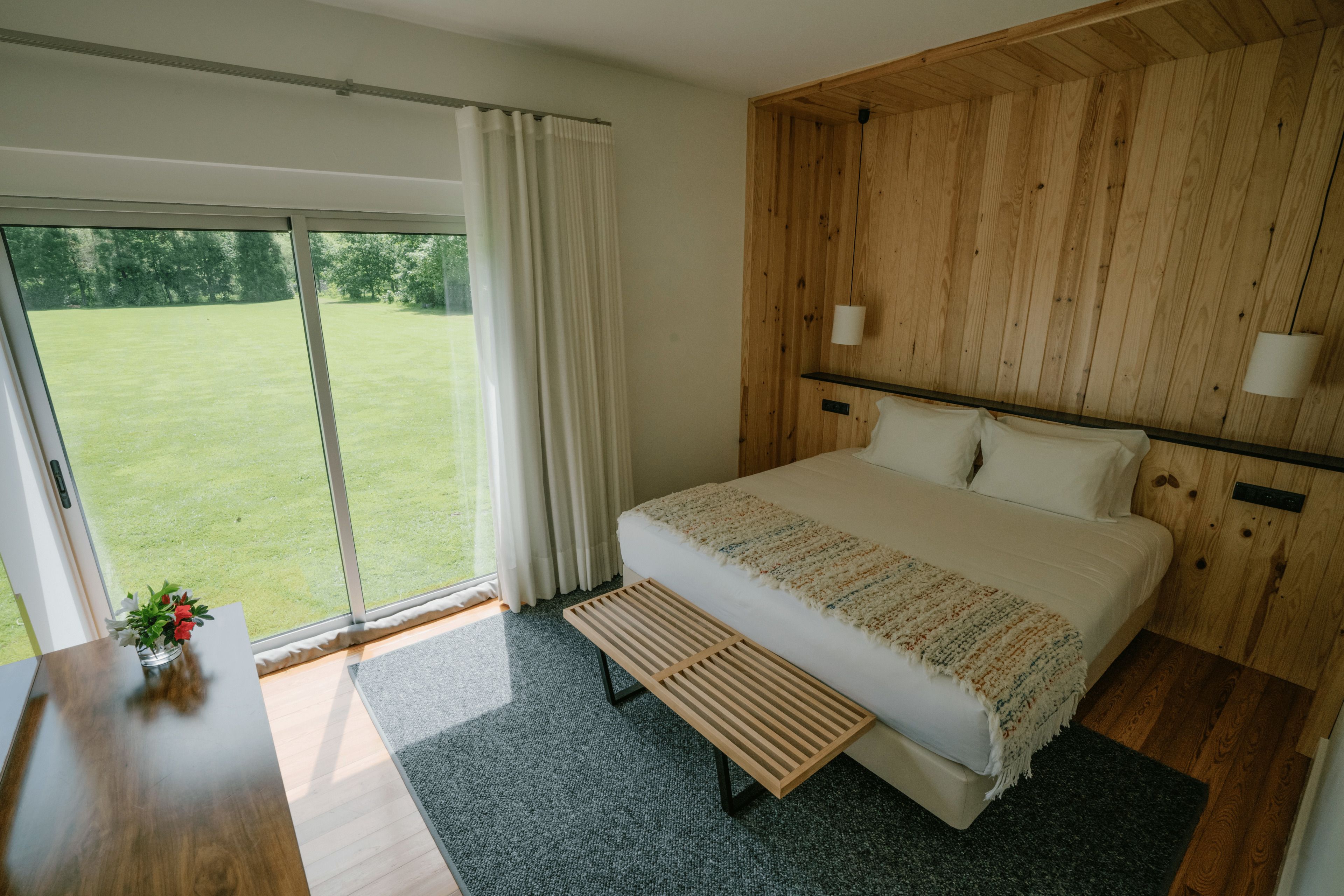 Premium bedding, laptop workspace, blackout drapes, soundproofing