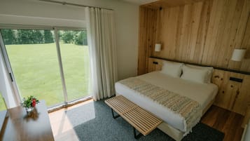 Premium bedding, laptop workspace, blackout drapes, soundproofing