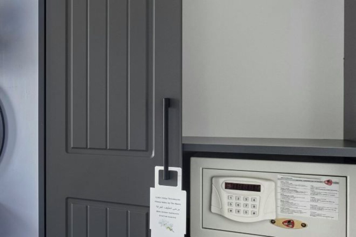 A door with a keypad lock and a card reader, suggesting a secure entry point.