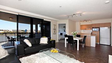 Premium Two-Bedroom Apartment | Living area | 50-inch TV with digital channels