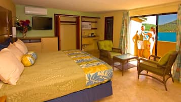 A hotel room with a bed, a television, a desk, and a chair.