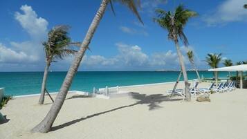 On the beach, sun-loungers, beach towels