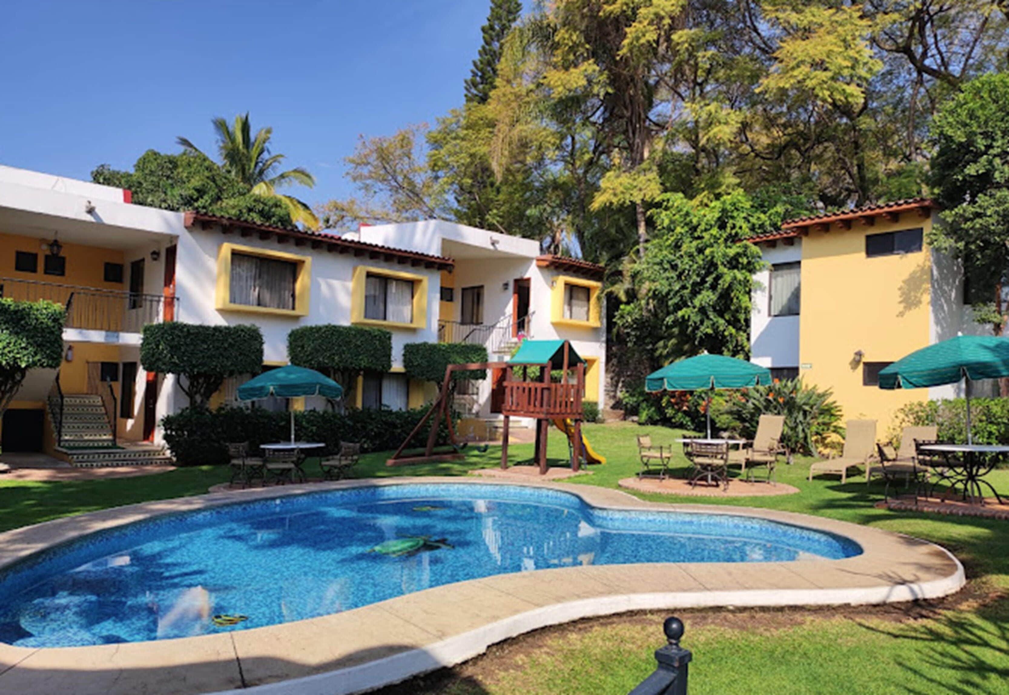 Outdoor pool, open 8:00 AM to 8:00 PM, sun loungers