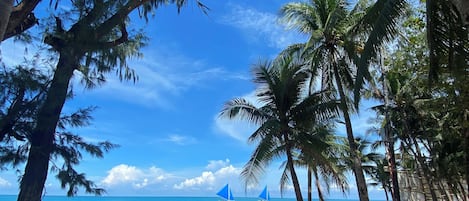On the beach, white sand, beach towels