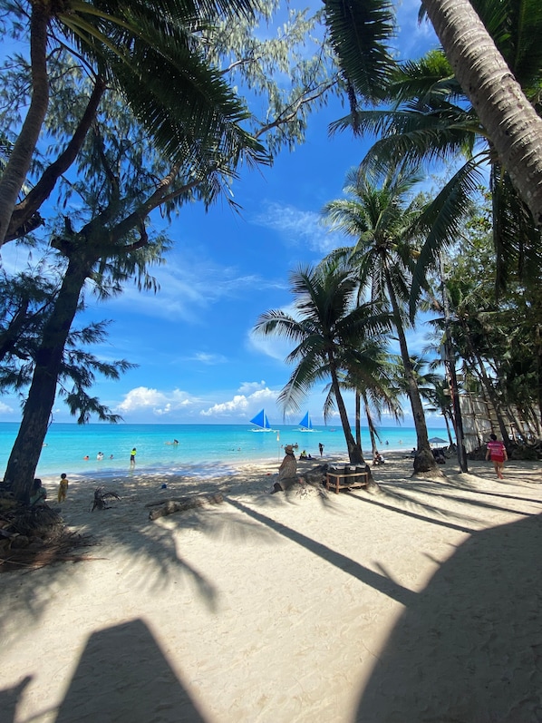 On the beach, white sand, beach towels - Nigi Nigi Too Beach Resort (Boracay Island)