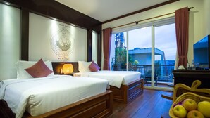 A hotel room with two beds, a TV, a fruit basket, and a balcony with a view. - Diamond D'Angkor Boutique (Siem Reap)