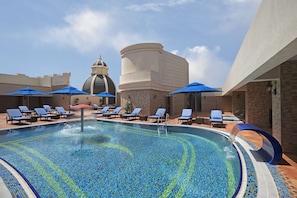 Outdoor pool, open 8:00 AM to 7:00 PM, pool umbrellas, pool loungers